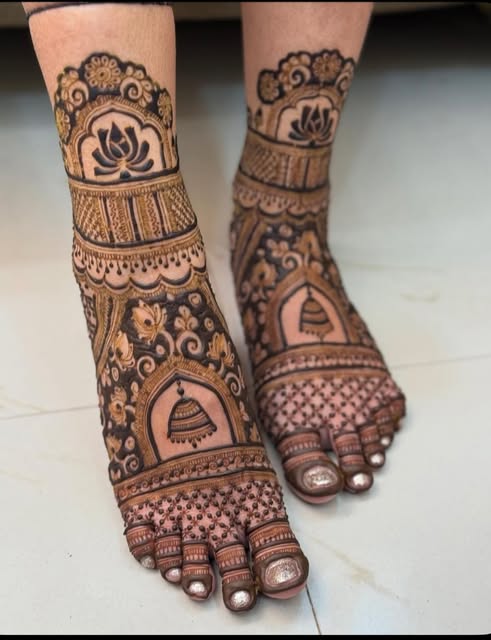 Bridal feet mehndi with lotus and jhumka motifs