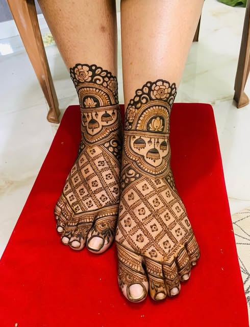 Traditional bridal feet mehndi with jaali and lotus work