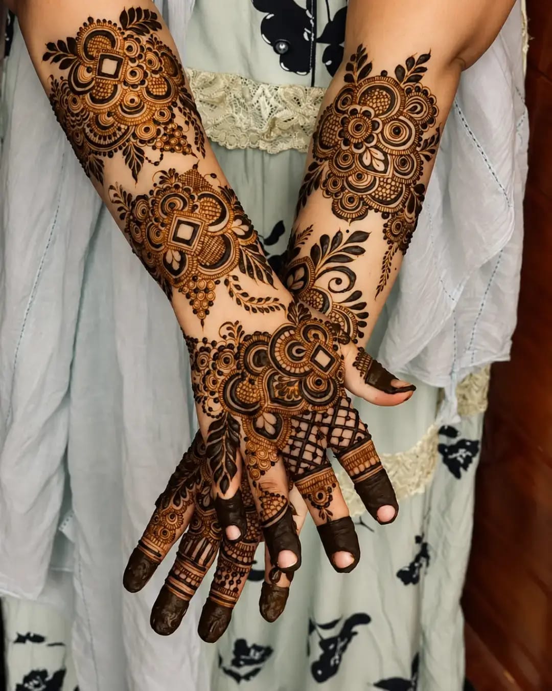 Arabic style bridal henna with floral motifs on both arms
