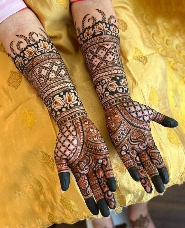 Rajasthani bridal mehndi with lotus and jaali panels on full arms