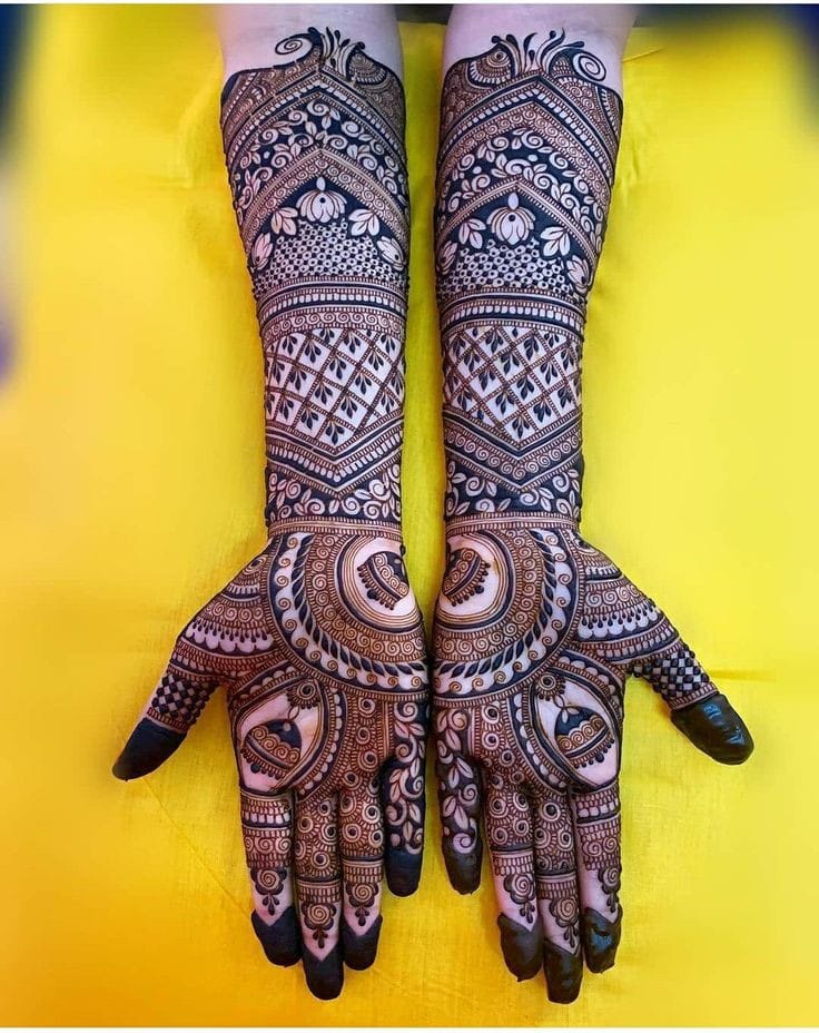 Dense traditional bridal mehndi with mandala palms