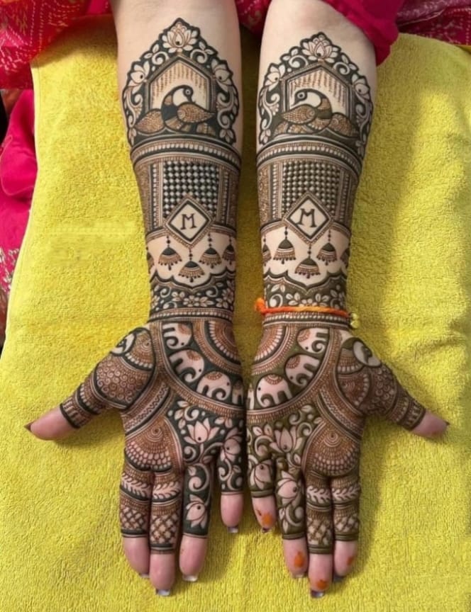 Bridal mehndi with peacock temple arch and elephant motifs