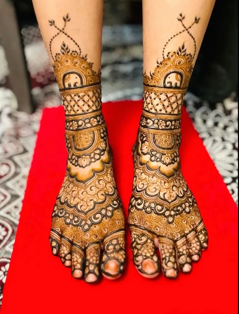 Feet mehndi with elephant and mandala motifs